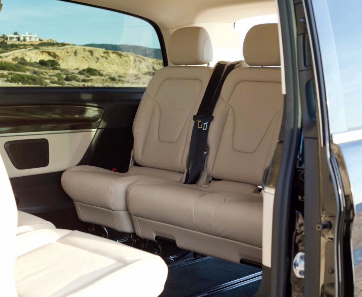 Mercedes V-Class cream-leather VIP interior with Ibiza coastline view